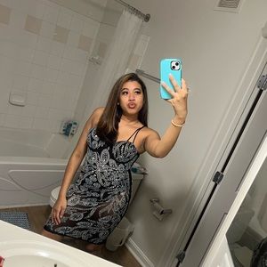 A Black see through dress with diamonds , in good condition